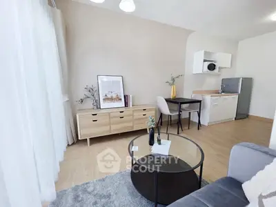Modern living room with stylish furniture and open kitchen layout