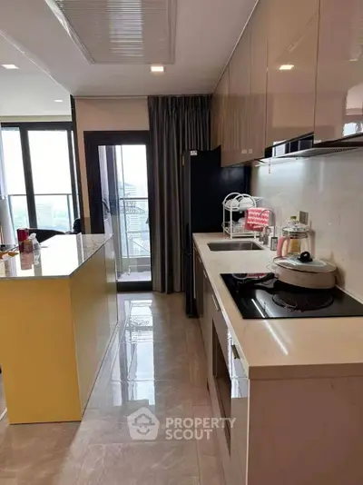 Modern kitchen with sleek design and open layout, featuring high-end appliances and ample natural light.