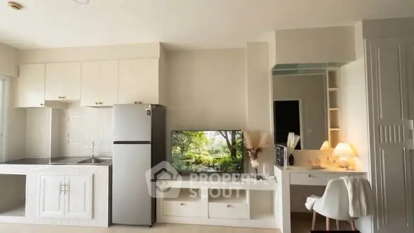 Modern studio apartment with sleek kitchen and cozy living area