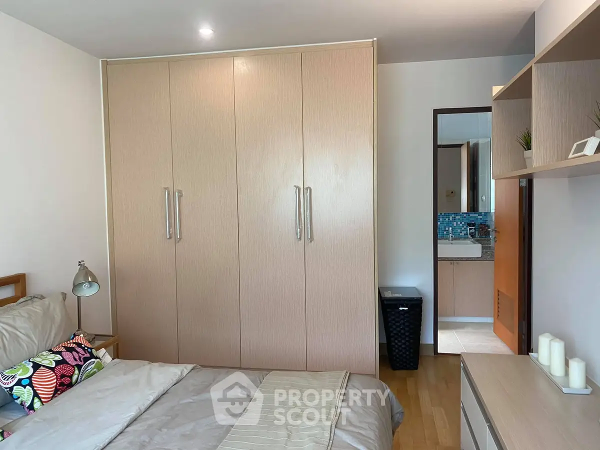 Modern bedroom with built-in wardrobe and cozy decor