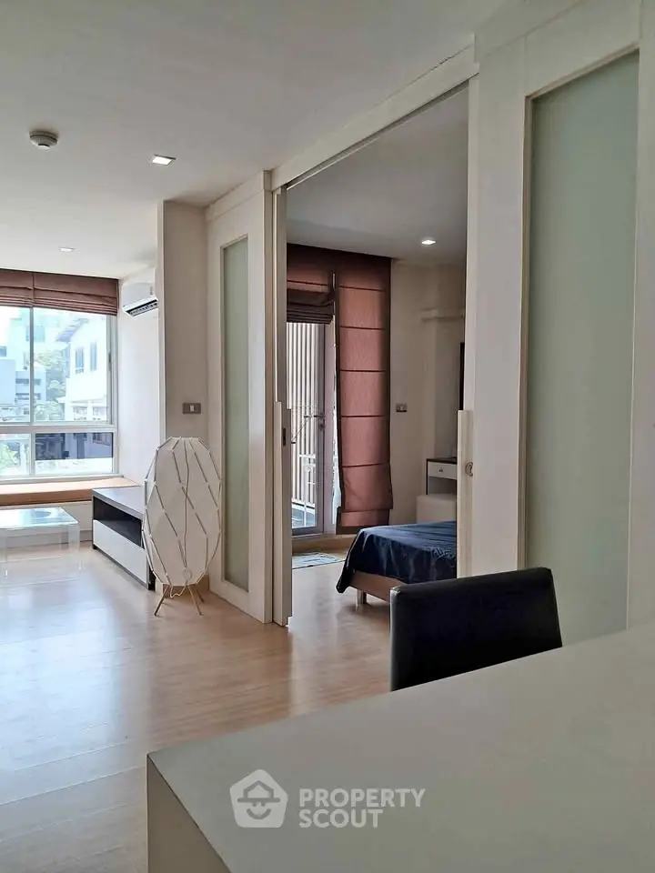 Modern apartment interior with sliding doors and natural light