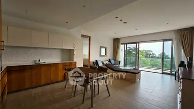 Spacious modern living room with open kitchen and stunning balcony view