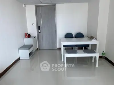 Minimalist apartment entrance with sleek furniture and glossy flooring