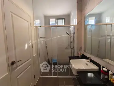 Modern bathroom with sleek design and glass shower enclosure