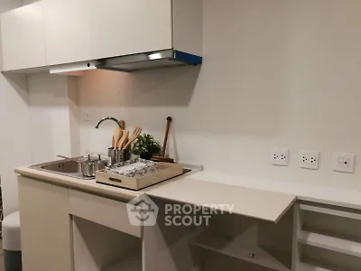 Modern kitchen with sleek cabinetry and built-in sink