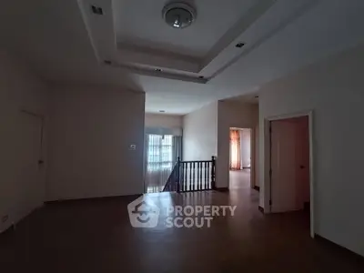 Spacious interior with elegant lighting and wooden flooring, ideal for modern living.