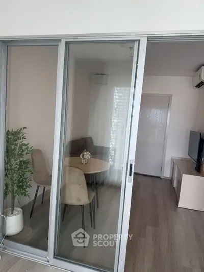 Modern living room with sliding glass doors and stylish furniture