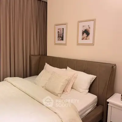 Cozy bedroom with elegant decor and plush bedding