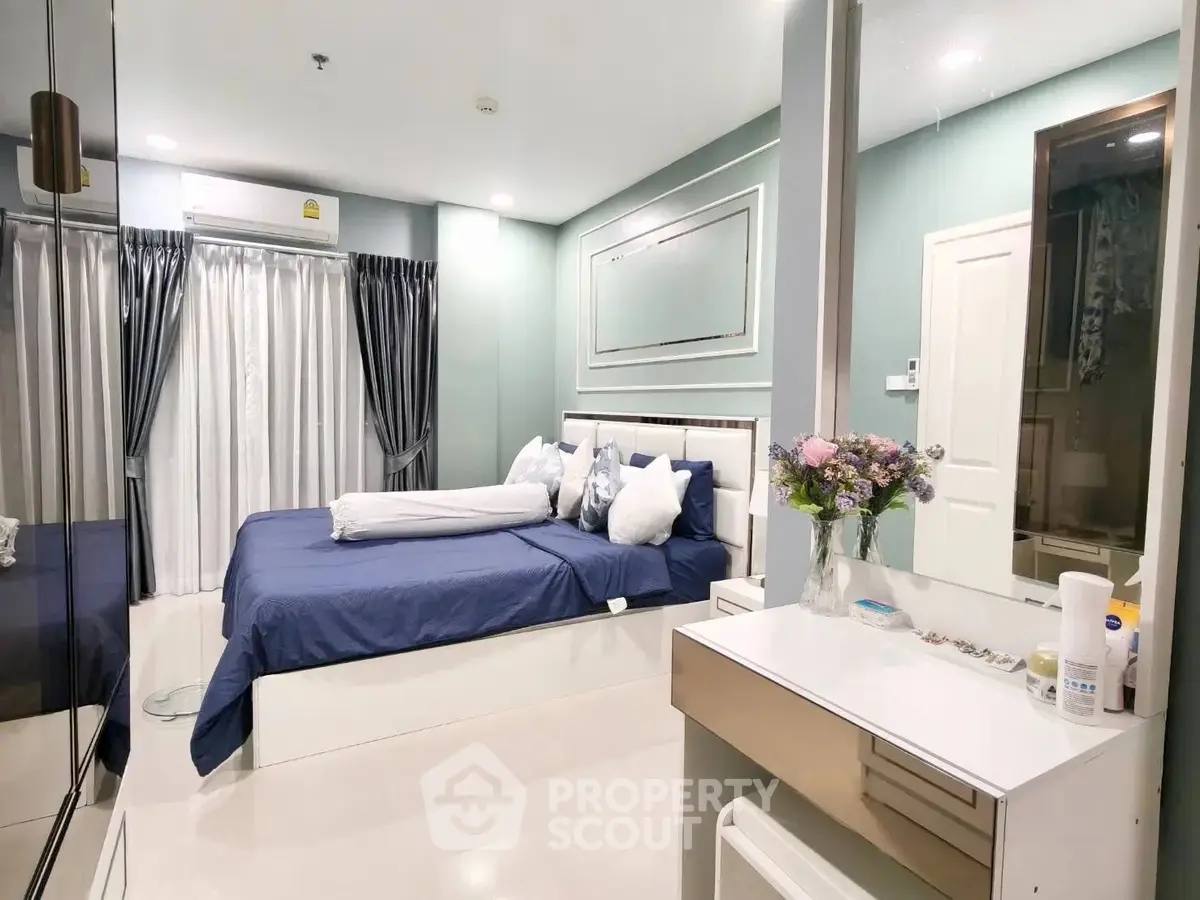 Luxurious bedroom with elegant decor and modern furnishings, featuring a cozy bed and stylish vanity.