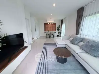 Spacious modern living room with elegant decor and natural light