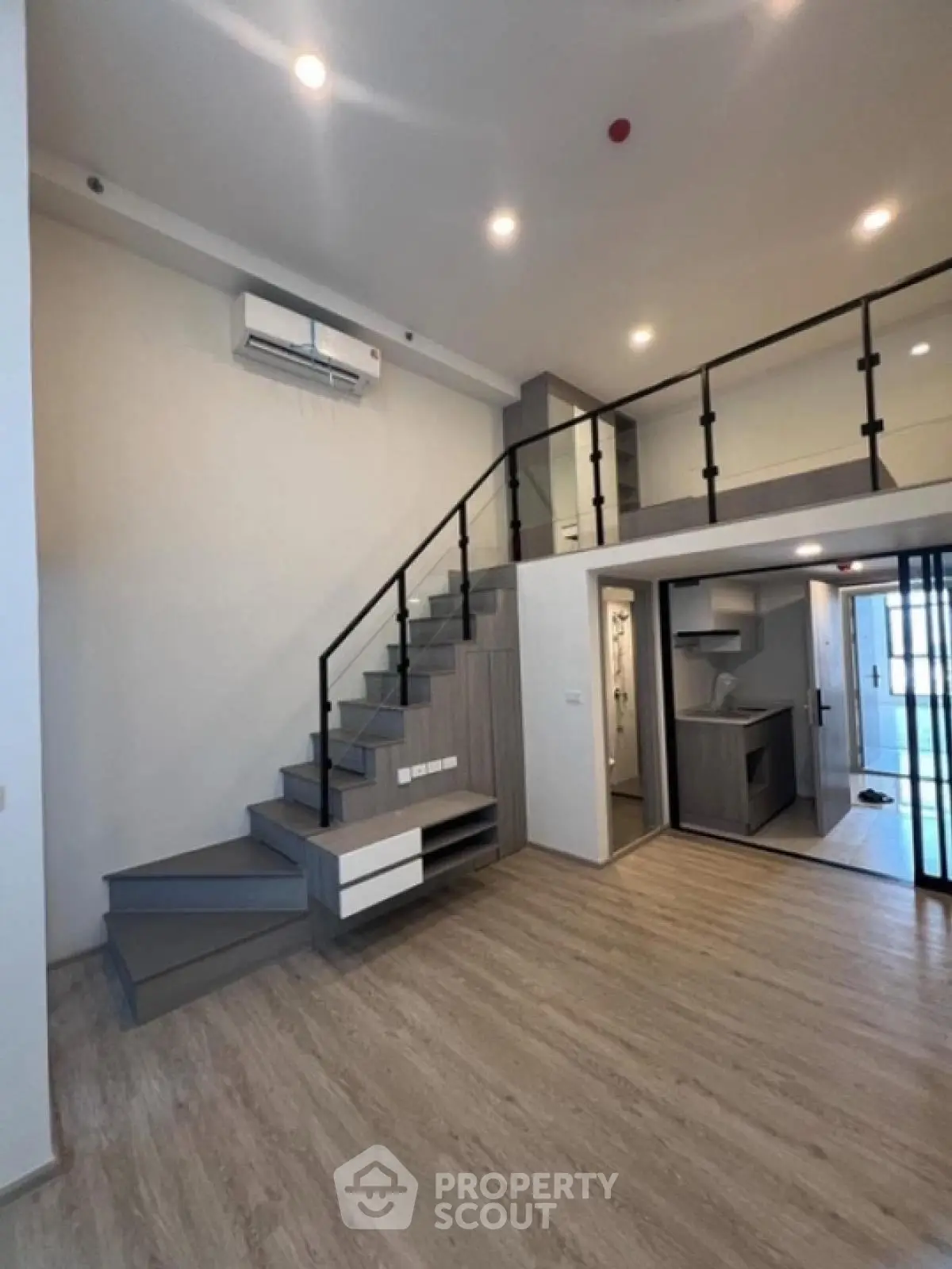 Modern loft apartment with stylish staircase and open layout