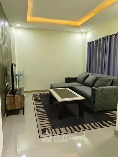 Modern living room with stylish sofa and ambient lighting