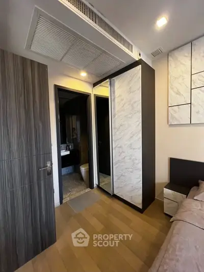 Modern bedroom with ensuite bathroom and stylish decor