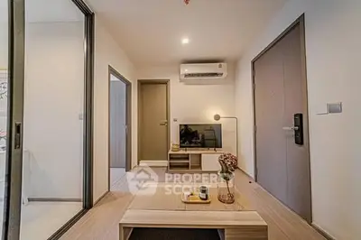 Modern living room with sleek design and air conditioning, perfect for relaxation.