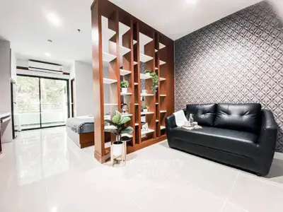 Modern open-plan living room with stylish decor and natural light