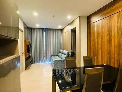 Modern living room with sleek furniture and wooden accents in a stylish apartment.