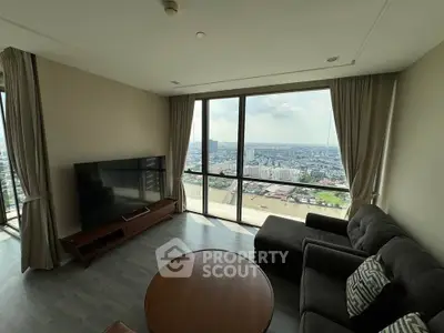 Spacious living room with panoramic city view and modern furnishings