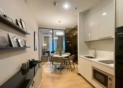 Modern kitchen with open layout and dining area in stylish apartment