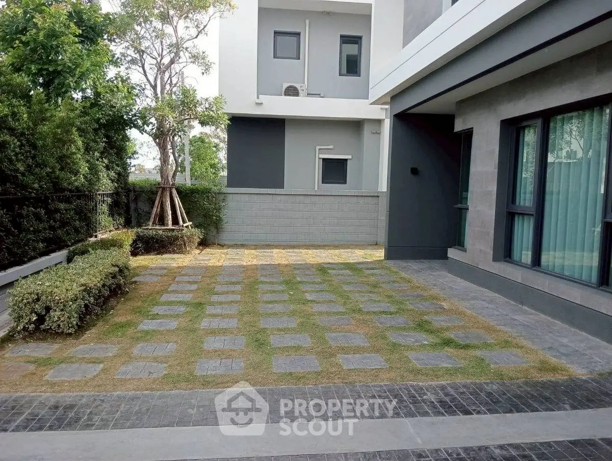 Modern home exterior with stylish landscaping and sleek design