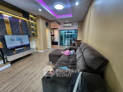 Modern living room with plush sectional sofa and stylish lighting