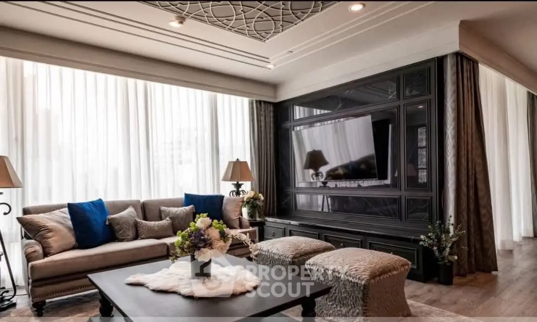 Luxurious living room with elegant decor, large windows, and stylish furniture, perfect for modern living.