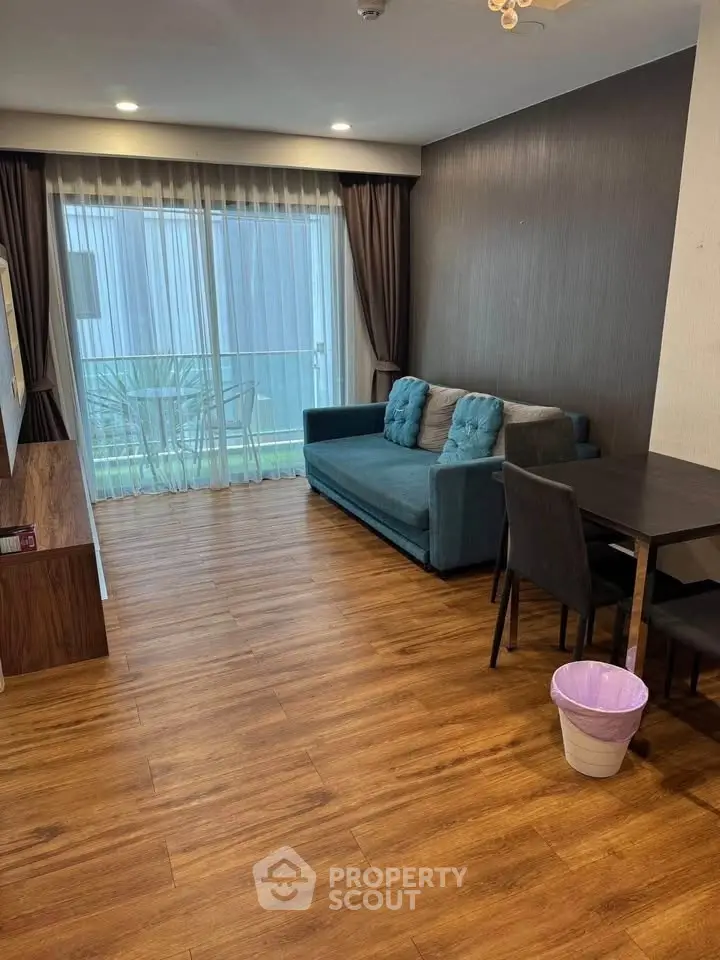 Modern living room with wooden flooring and stylish furniture