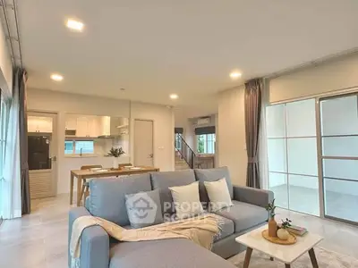 Spacious modern living room with open kitchen and stylish decor