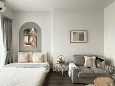 Chic modern living room with cozy sofa and stylish decor in neutral tones