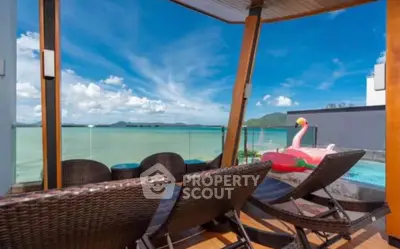 Luxurious balcony with stunning ocean view and pool, perfect for relaxation and leisure.