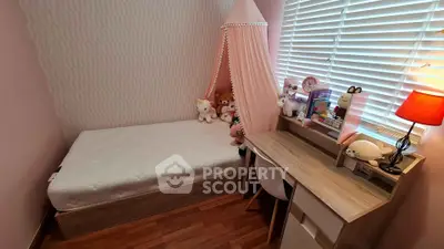 Charming bedroom with cozy decor and natural light, perfect for a child's retreat.