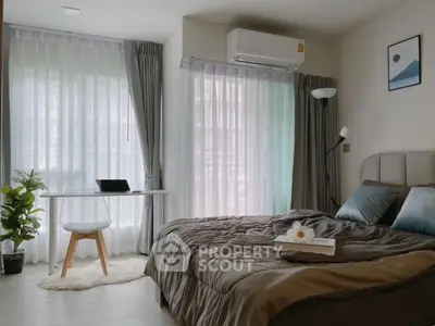 Modern bedroom with stylish decor and natural light