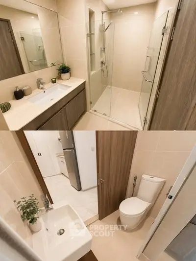 Modern bathroom with glass shower and sleek fixtures in contemporary apartment.