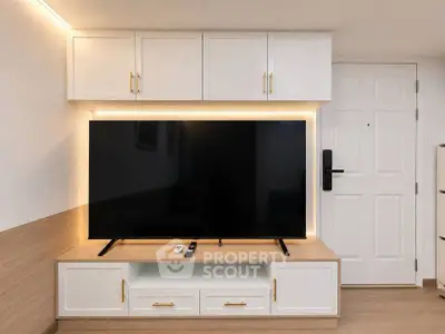 Modern living room with sleek TV unit and ambient lighting