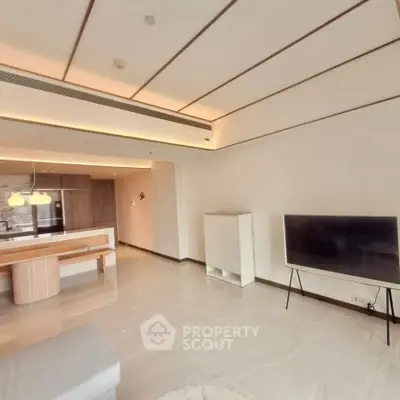 Spacious modern living room with open layout and stylish lighting