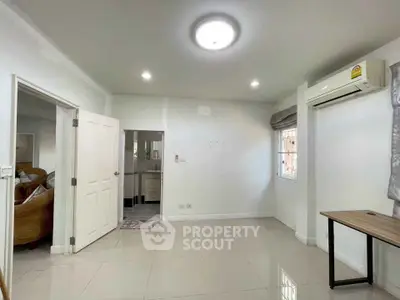 Spacious living room with modern air conditioning and natural light