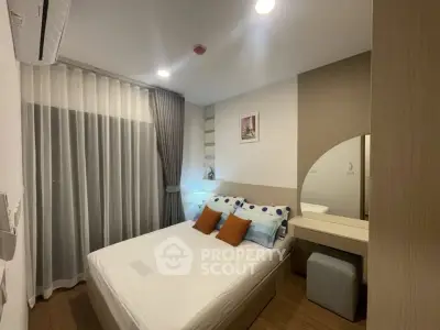 Cozy modern bedroom with stylish decor and ample natural light