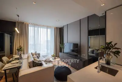 Modern living room with stylish decor and open kitchen layout