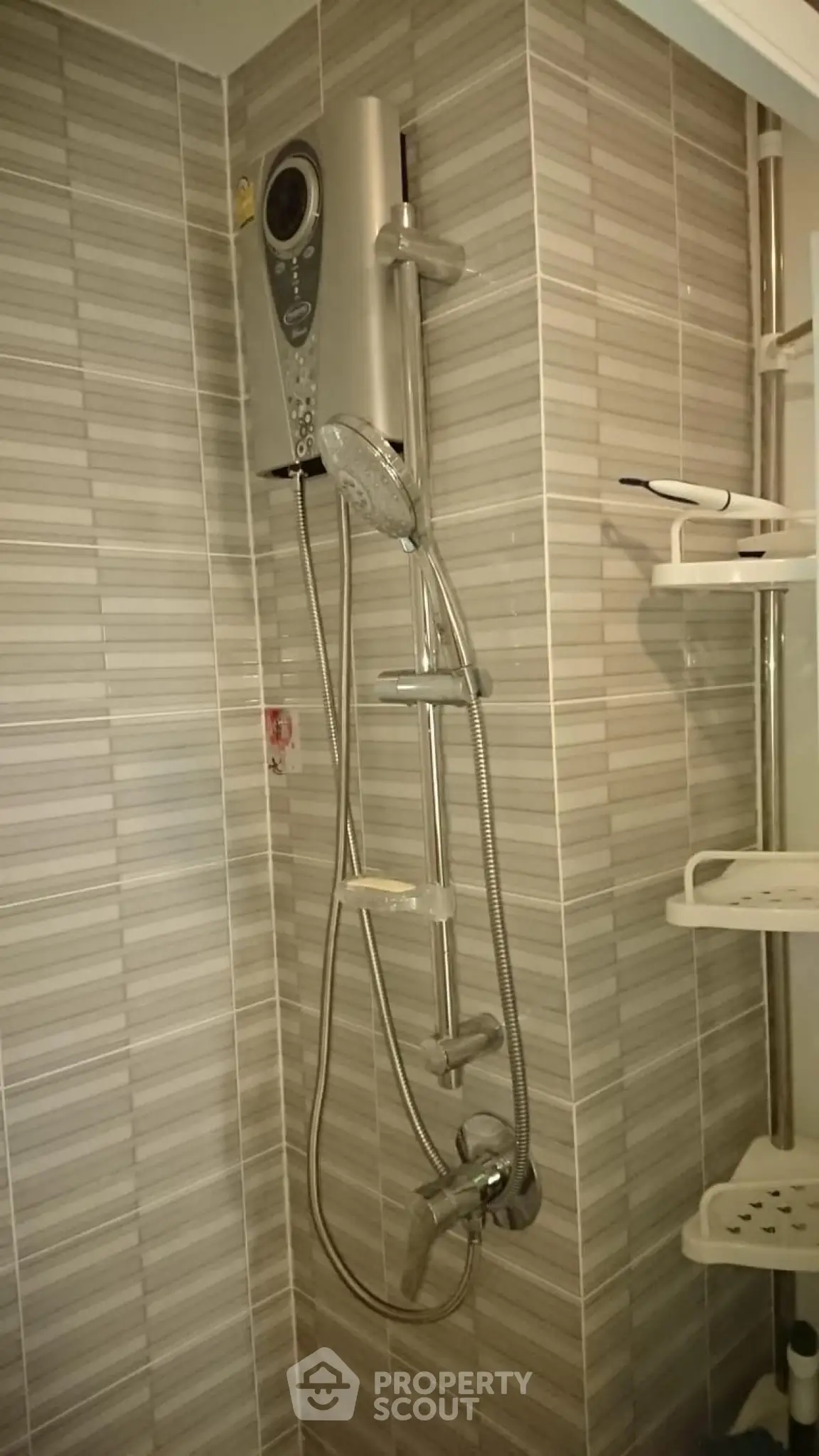 Modern bathroom with sleek shower system and stylish tile design