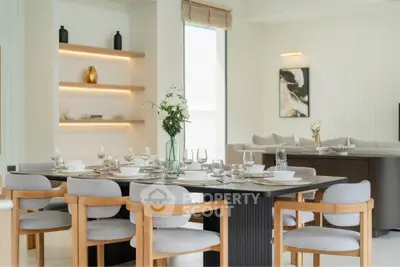 Elegant dining area with modern decor and stylish furniture in a bright, open-concept living space.