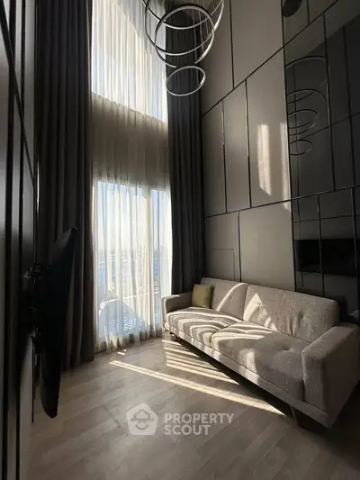 Modern living room with high ceiling and elegant decor