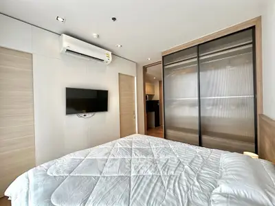 Modern bedroom with sleek design and built-in wardrobe