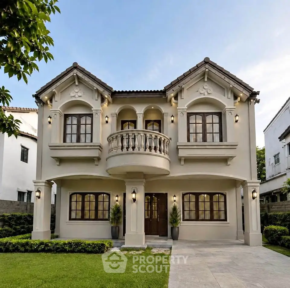 Elegant two-story house with classic architecture and lush landscaping