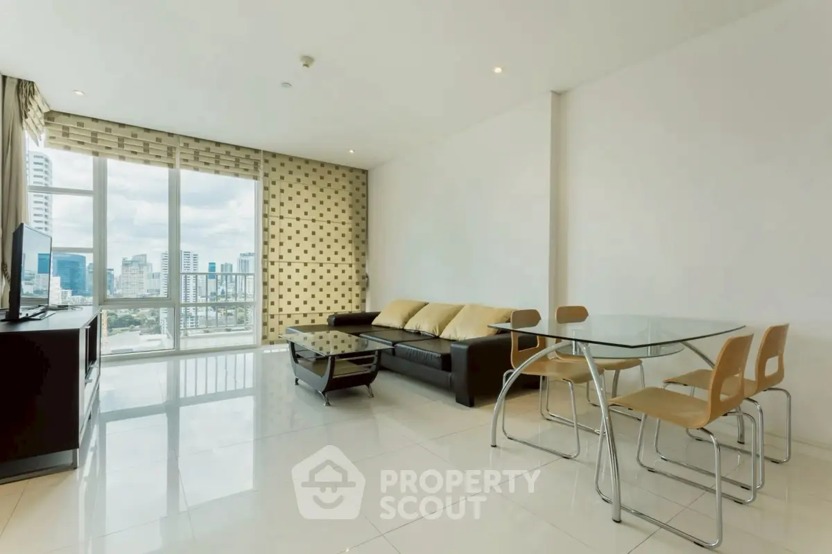 Spacious modern living room with city view, sleek furniture, and natural light.