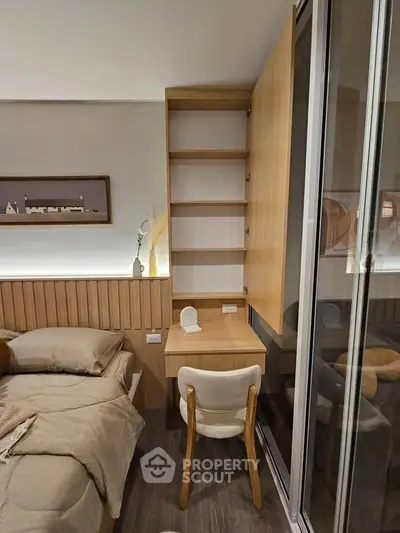 Modern bedroom with built-in wooden shelves and cozy study nook