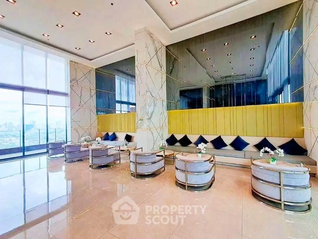 Luxurious high-rise building lobby with modern seating and panoramic city views.