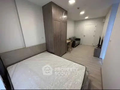 Modern studio apartment with sleek furniture and open layout, perfect for urban living.