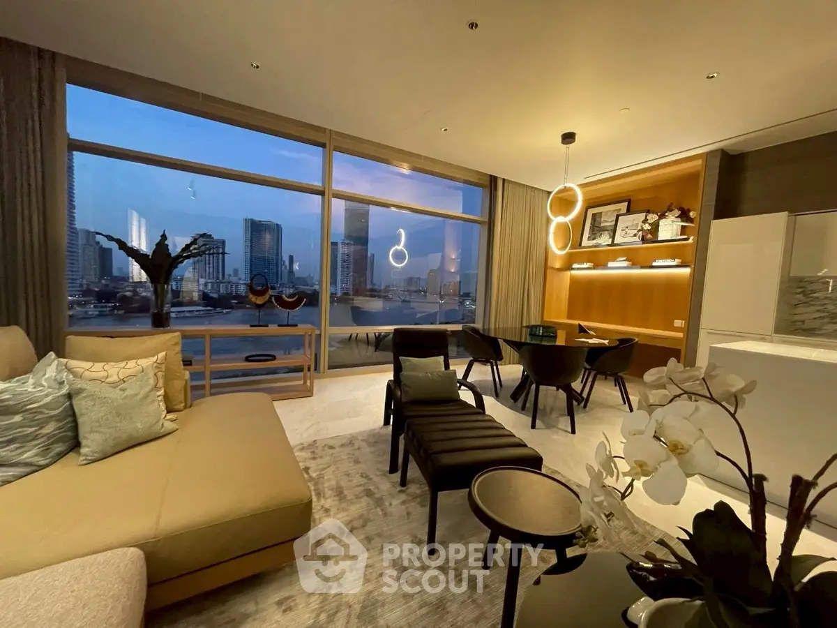 Luxurious living room with stunning city view, modern decor, and elegant lighting.