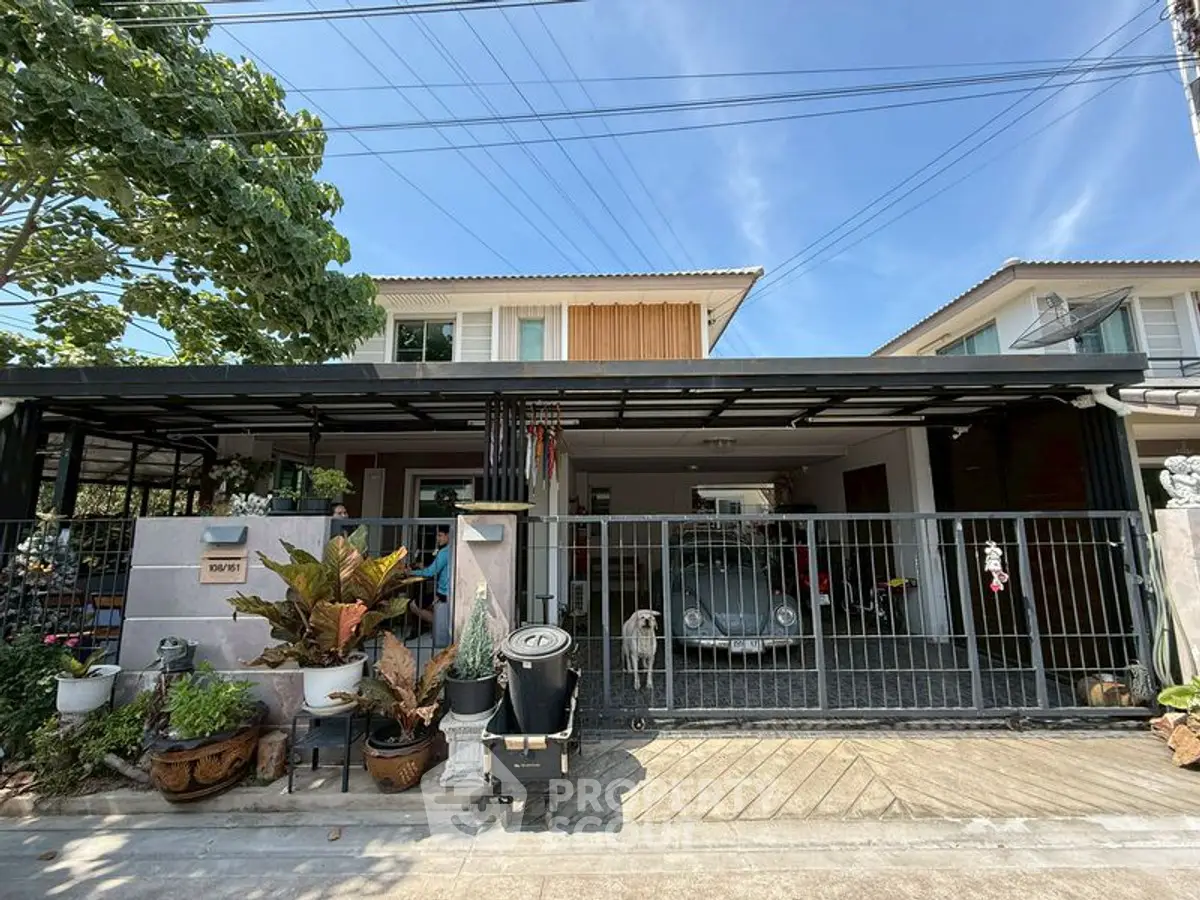 Charming suburban home with spacious driveway and lush greenery