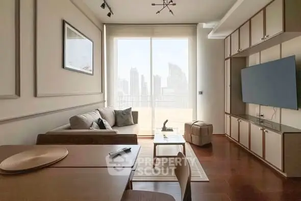 Modern living room with city view, featuring sleek furniture and large TV, perfect for urban living.