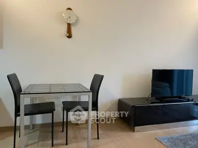 Modern living room with sleek furniture and stylish wall clock